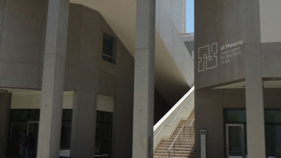 Mockup of an NYUAD campus building with the al Mawrid logo.