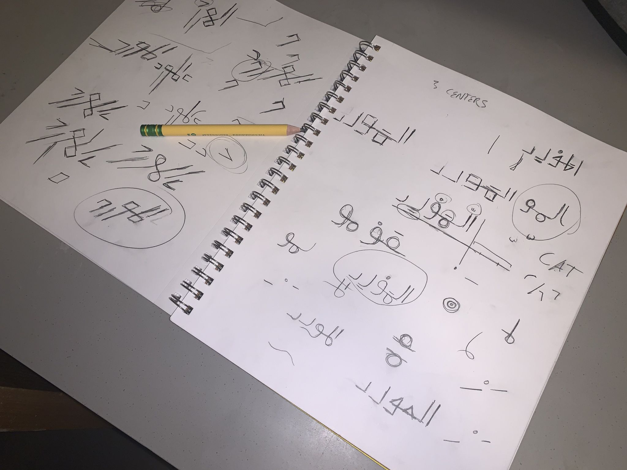 2 pages of preliminary logo sketches.