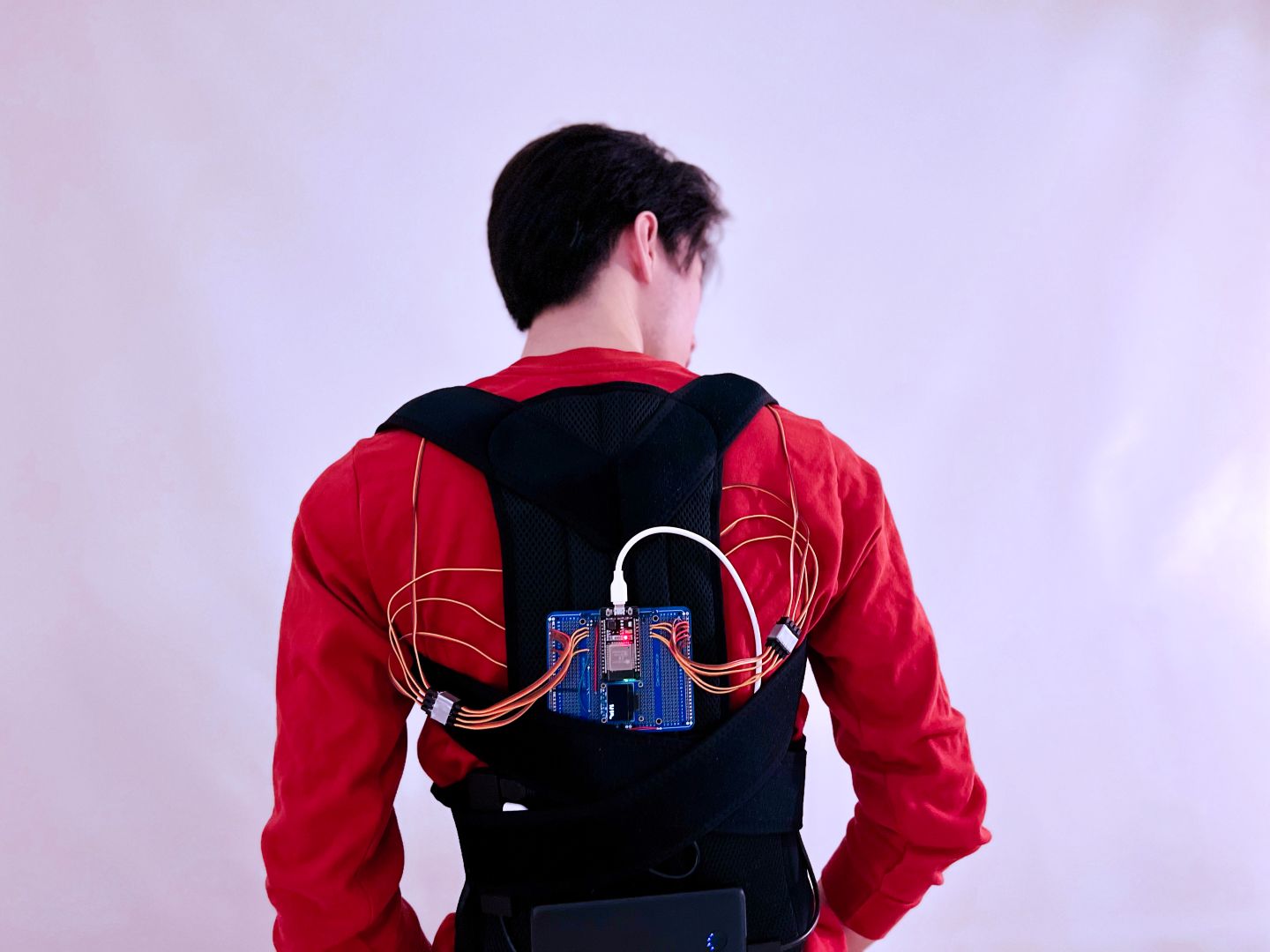 Ben Pang wearing the Feel the Hive backscratcher rig.